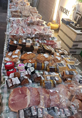 Priors Hall Farm's stall at a farmer market